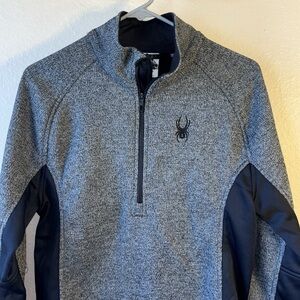 Spyder quarter zip gray with black on sides and underneath arms. Has spider logo
